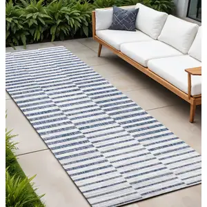 Photo of 10' Ivory And Blue Striped Indoor Outdoor Runner Rug