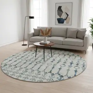 Photo of 8' Ivory And Blue Tribal Washable Round Rug With UV Protection