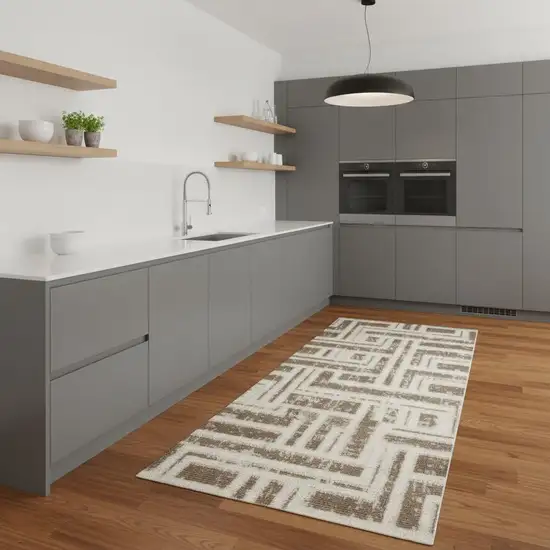 8' Ivory And Brown Geometric Runner Rug Photo 1