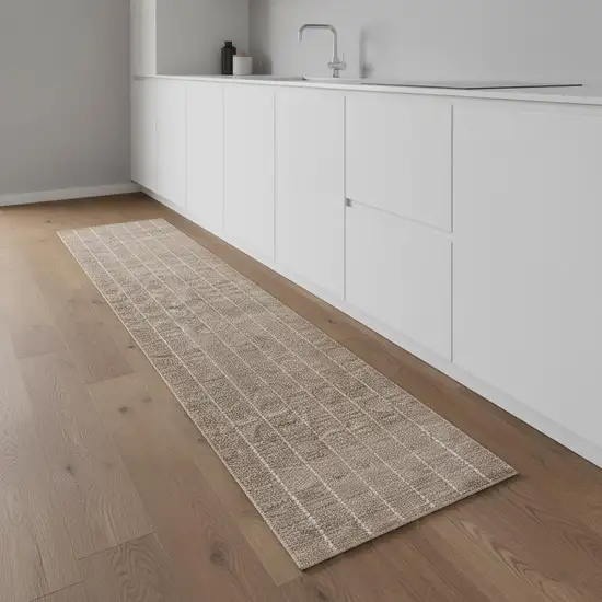 8' Ivory And Brown Geometric Runner Rug Photo 1