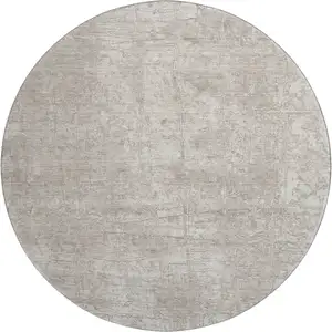 Photo of 8' Ivory And Cream Abstract Washable Round Rug With UV Protection