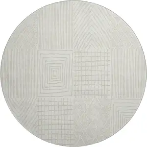 Photo of 8' Ivory And Cream Geometric Washable Round Rug With UV Protection