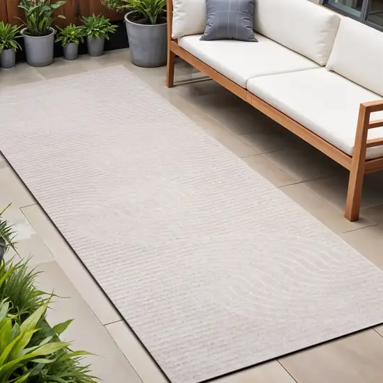 10' Ivory And Cream Striped Indoor Outdoor Runner Rug Photo 1
