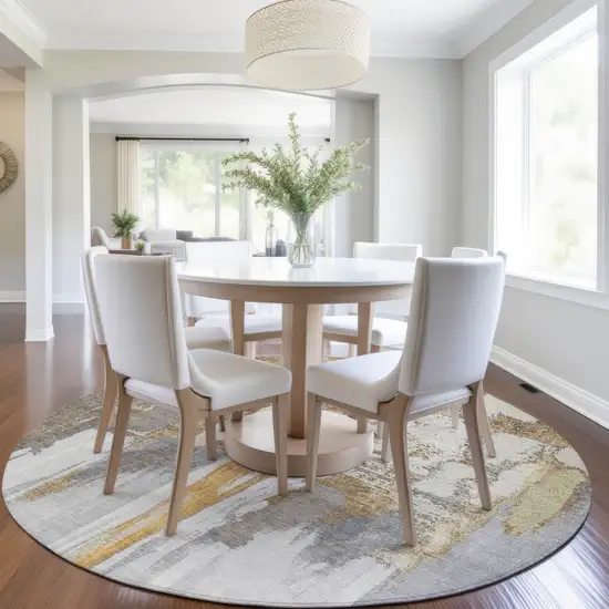 8' Ivory And Gold Round Abstract Washable Indoor Outdoor Area Rug Photo 5