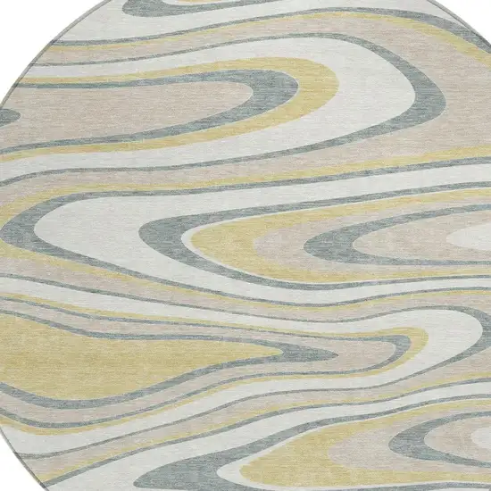 8' Ivory And Gold Round Abstract Washable Indoor Outdoor Area Rug Photo 3