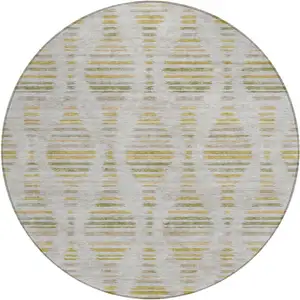 Photo of 8' Ivory And Gold Round Striped Washable Indoor Outdoor Area Rug