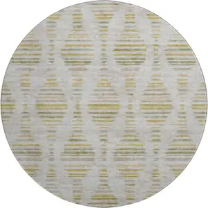 Photo of 8' Ivory And Gold Striped Washable Round Rug With UV Protection