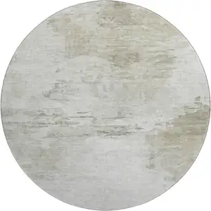 Photo of 8' Ivory And Gray Abstract Washable Round Rug With UV Protection