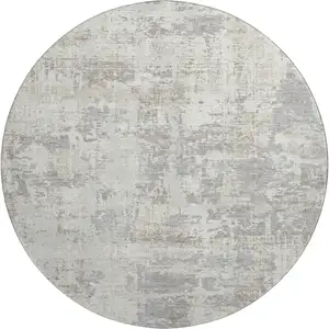 Photo of 8' Ivory And Gray Abstract Washable Round Rug With UV Protection
