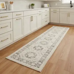 Photo of 8' Ivory And Gray Geometric Distressed Runner Rug