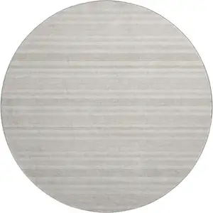 Photo of 8' Ivory And Gray Striped Washable Round Rug With UV Protection