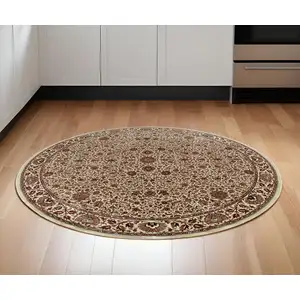 Photo of 6' Ivory And Green Oriental Round Rug