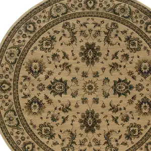 Photo of 6' Ivory And Green Oriental Round Rug