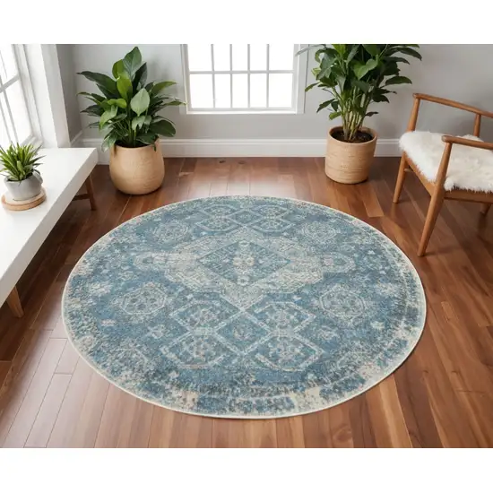 8' Ivory And Light Blue Geometric Distressed Round Rug Photo 1