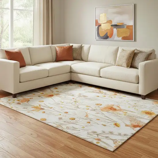 8' Ivory And Orange Floral Washable Area Rug With UV Protection Photo 2