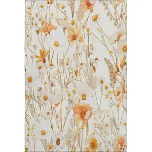 Photo of 8' Ivory And Orange Floral Washable Area Rug With UV Protection
