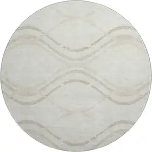 Photo of 8' Ivory And Taupe Abstract Washable Round Rug With UV Protection
