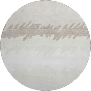 Photo of 8' Ivory And Taupe Striped Washable Round Rug With UV Protection