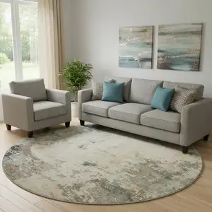 Photo of 8' Ivory And Teal Abstract Washable Round Rug With UV Protection