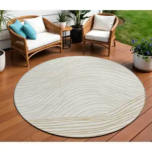 Photo of 8' Ivory And Wheat Round Striped Washable Indoor Outdoor Area Rug