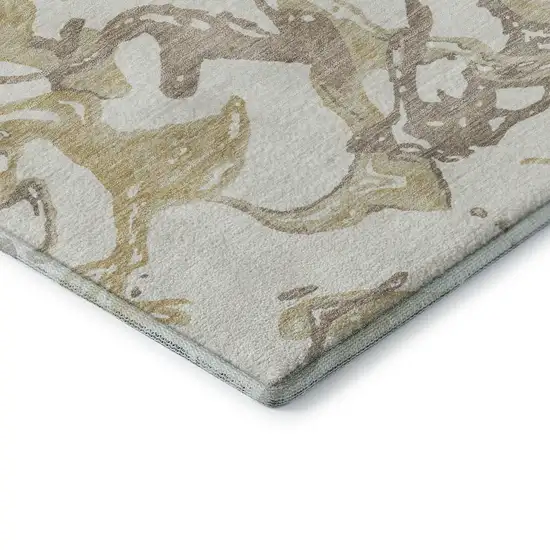 8' Ivory Beige And Gold Abstract Washable Round Rug With UV Protection Photo 6
