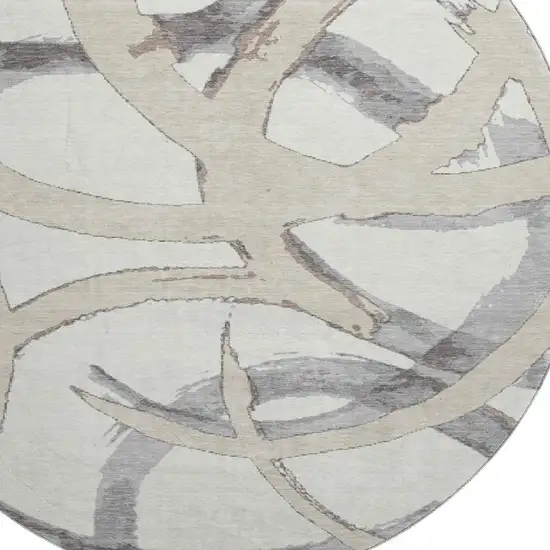 8' Ivory Beige And Gray Abstract Washable Round Rug With UV Protection Photo 2