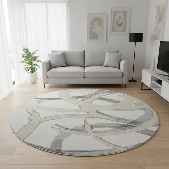 8' Ivory Beige And Gray Abstract Washable Round Rug With UV Protection Photo 2
