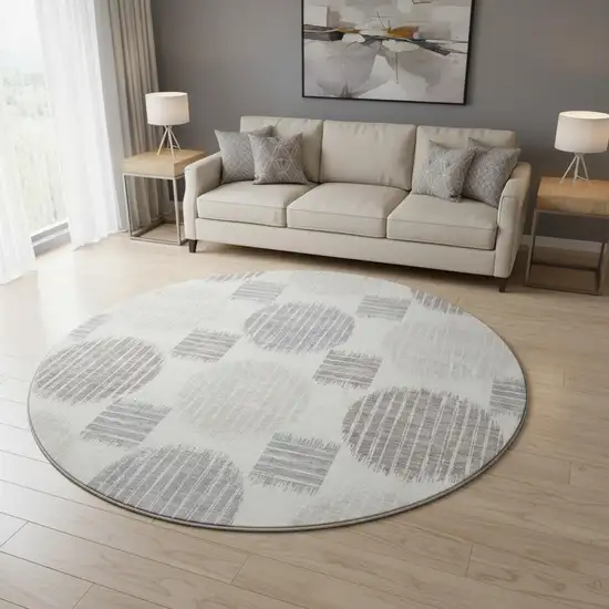 8' Ivory Beige And Gray Geometric Washable Round Rug With UV Protection Photo 2