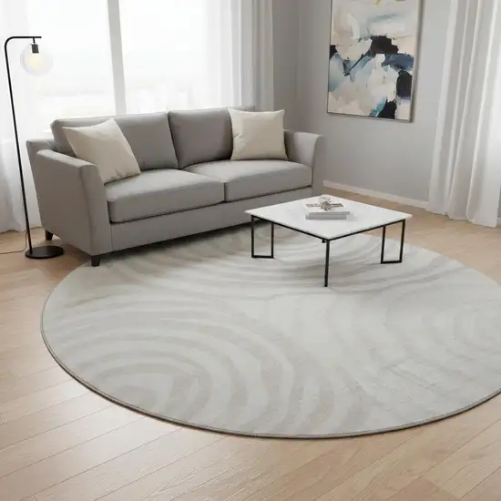 8' Ivory Beige And Khaki Abstract Washable Round Rug With UV Protection Photo 2