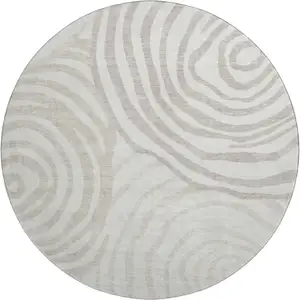 Photo of 8' Ivory Beige And Khaki Abstract Washable Round Rug With UV Protection
