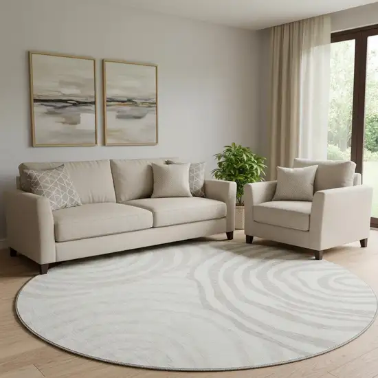 8' Ivory Beige And Khaki Abstract Washable Round Rug With UV Protection Photo 1