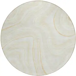 Photo of 8' Ivory Beige And Tan Round Abstract Washable Indoor Outdoor Area Rug