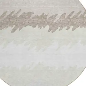 Photo of 8' Ivory Beige And Taupe Round Striped Washable Indoor Outdoor Area Rug