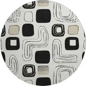 Photo of 8' Ivory Black And Beige Geometric Washable Round Rug With UV Protection