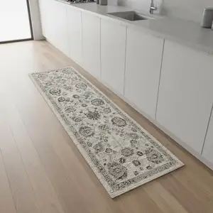 Photo of 8' Ivory Black And Gray Floral Distressed Non Skid Runner Rug