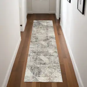 Photo of 8' Ivory Black and Brown Geometric Non Skid Runner Rug
