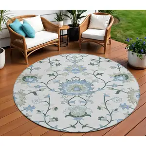 Photo of 8' Ivory Blue And Beige Round Floral Washable Indoor Outdoor Area Rug