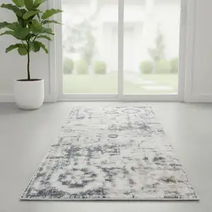 Photo of 6' Ivory Blue And Brown Floral Distressed Runner Rug
