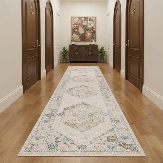 10' Ivory Blue And Brown Geometric Runner Rug Photo 1