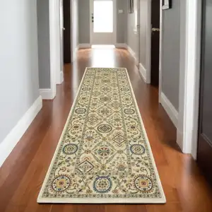 Photo of 8' Ivory Blue And Burnt Orange Oriental Runner Rug With Fringe