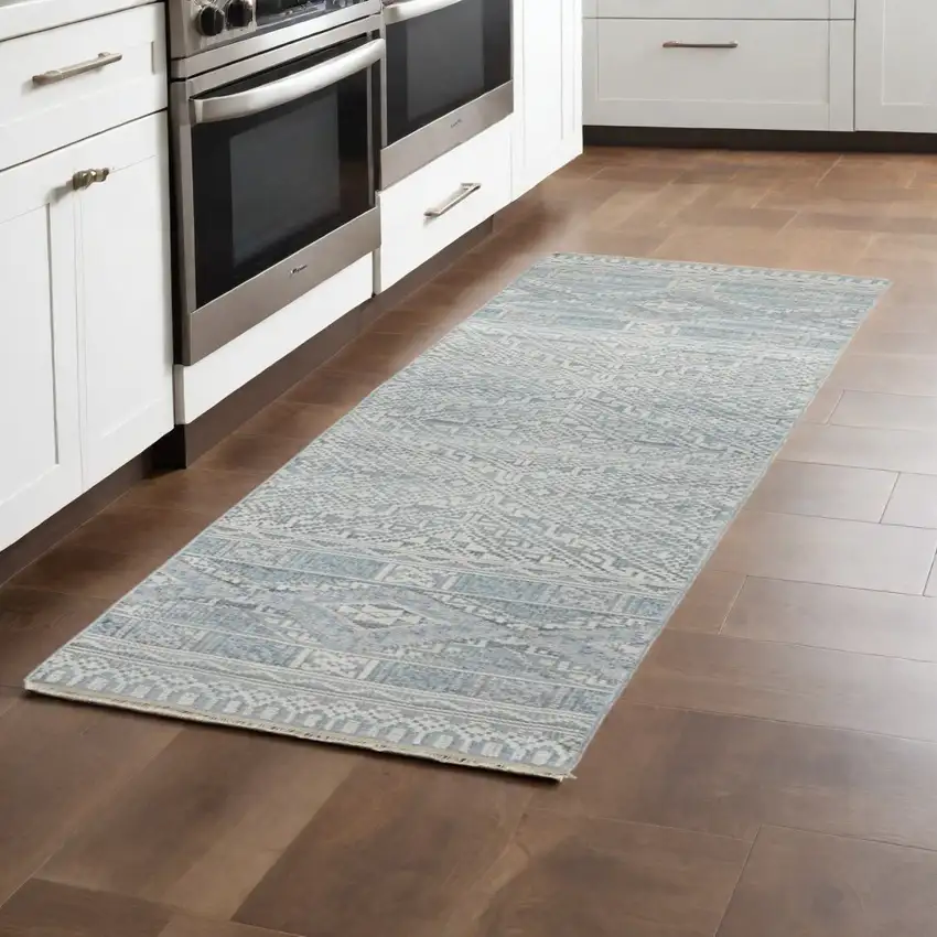 10' Ivory and Blue Geometric Hand Knotted Runner Rug With Fringe Photo 1