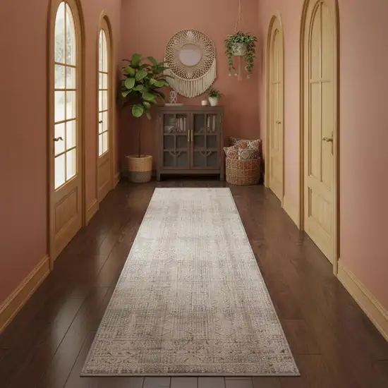 12' Ivory Brown And Gray Geometric Distressed Runner Rug With Fringe Photo 1