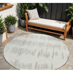 Photo of 8' Ivory Brown And Gray Round Striped Washable Indoor Outdoor Area Rug