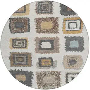 Photo of 8' Ivory Charcoal And Gold Round Geometric Washable Indoor Outdoor Area Rug