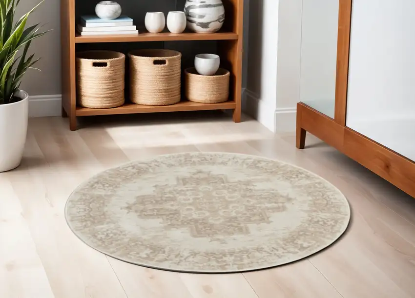 4' Ivory Floral Power Loom Worn Faded Round Rug Photo 1