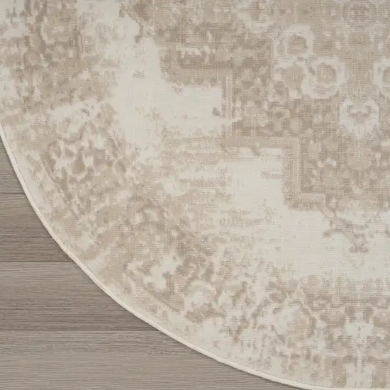 4' Ivory Floral Power Loom Worn Faded Round Rug Photo 9