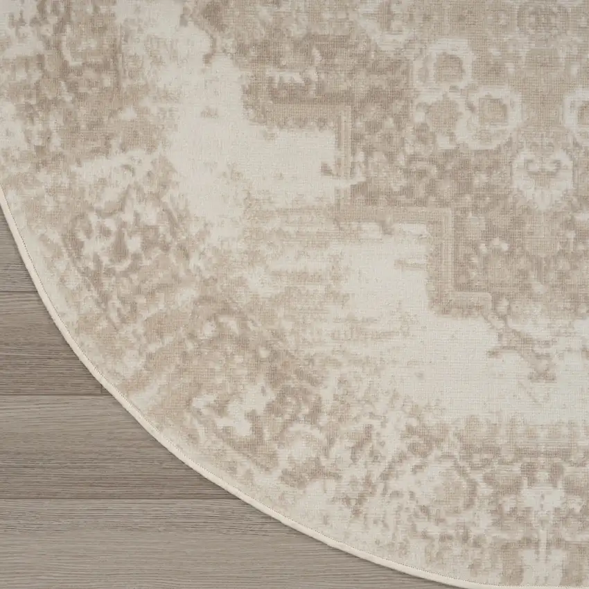 4' Ivory Floral Power Loom Worn Faded Round Rug Photo 9