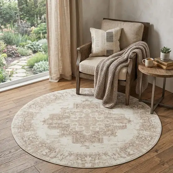 5' Ivory Floral Power Loom Worn Faded Round Rug Photo 1