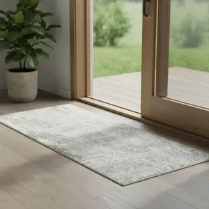 Photo of 6' Ivory Floral Power Loom Worn Faded Runner Rug