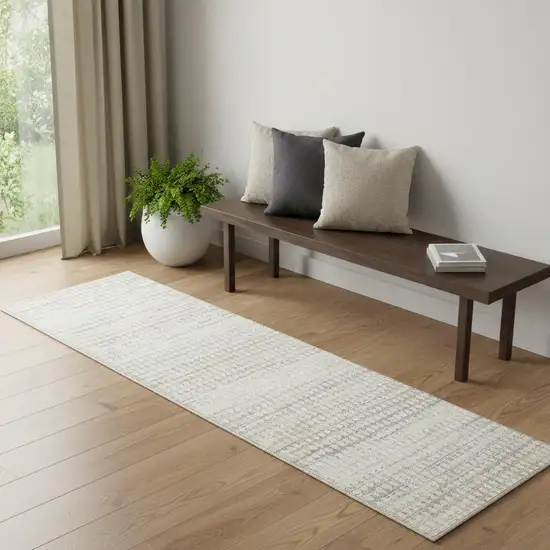 7' Ivory Geometric Distressed Runner Rug Photo 1